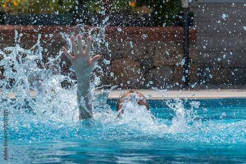 Person drowns in the pool with splashes