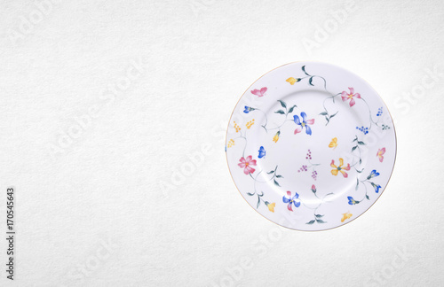 plate or flowers on plate painted by hand on background.