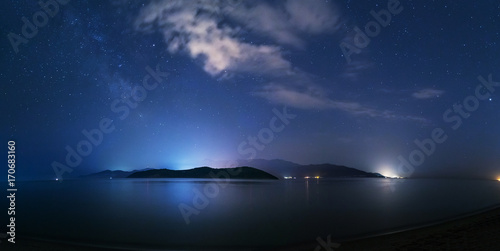 Night starry sky on the beach in Keramoti, Greece