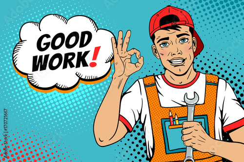 Wow pop art worker face. Young handsome man in coveralls and baseball cap smiles, shows okay sign, holds wrench and Good work! speech bubble. Vector illustration in retro comic pop art style. 