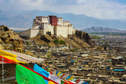 Panchen Lama residency called Little Potala in Shigatse city, Tibet, China. Cityscape from old buddhist monastery.