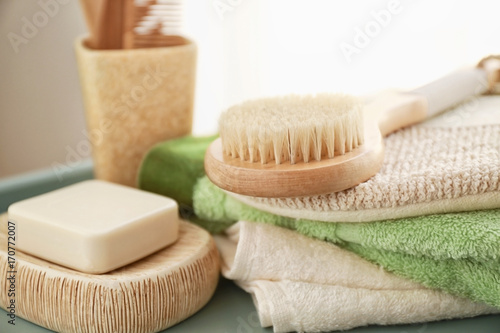 Composition with bath accessories and soap on table