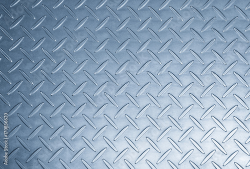 The metal texture background in light blue scene.Th texture at the metal plat for anti-slip reason