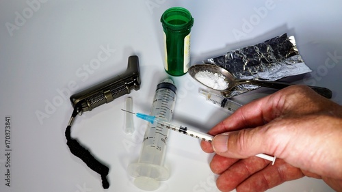 Opioids - Drug Addiction - Opioid Epidemic - Syringe and Drug Paraphernalia.