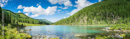 Panoramic view on mountain lake in front of mountain range, national park in Altai republic, Siberia, Russia