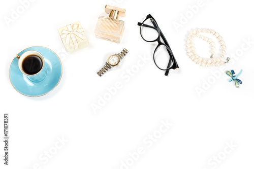 Fashion blogger objects flat lay. Beauty products, tea cup and stylish female accessories on white background