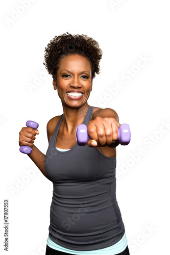African American woman lifting weights.