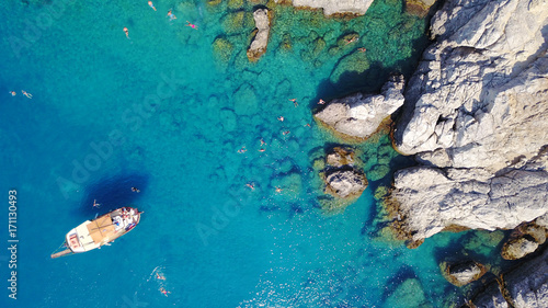 Aerial drone photo of paradise beach of Traganou with small caves and turquoise clear waters, Rhodes island, Dodecanese, Aegean, Greece