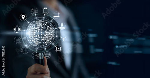 Businessman holding magnifying glass, search payments online shopping and icon customer network connection on screen, m-banking and omni channel