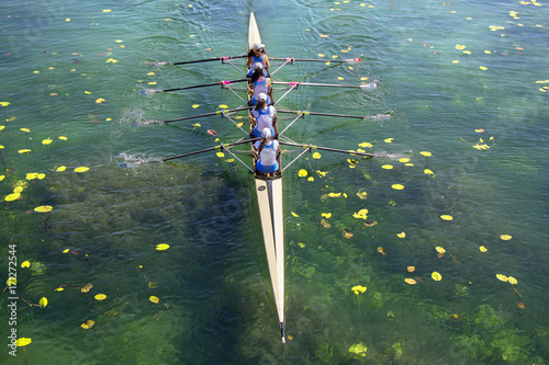 Ladies fours rowing team in race on the lake