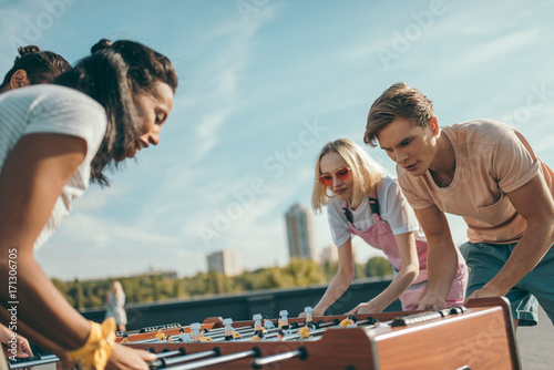 friends playing table football