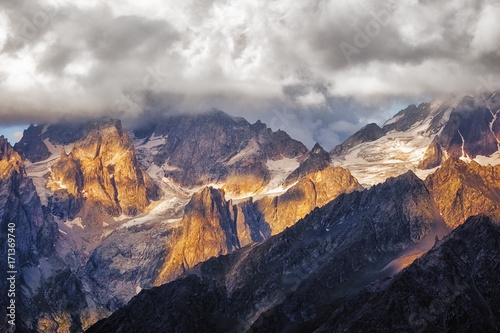 Detail of dramatic mountain range with colorful sunlight, Svaneti, Georgia