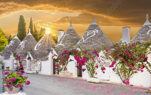 Trulli houses in Alberobello city at sunset time, Apulia, Italy.