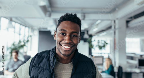 Handsome young man in design office