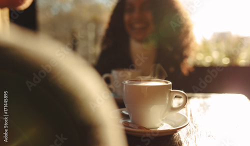 Steaming hot coffee at a coffee shop