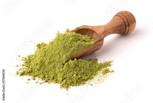 Wooden scoop of henna powder