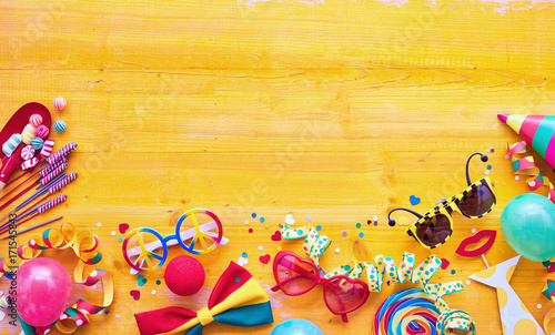 Carnival accessories against wooden background