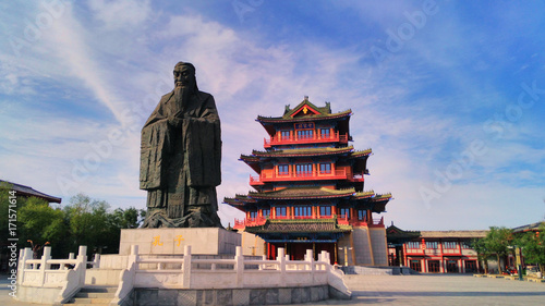  the giant statue of Confucius and ancient chinese pavilion in the ancient capital Kaifeng, China