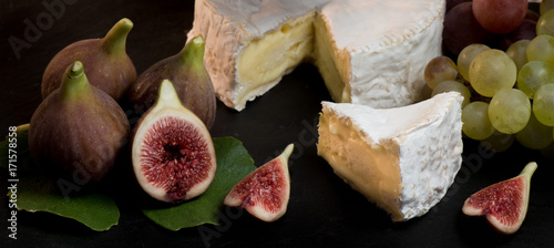 cheese with fresh figs, camenbert on black background