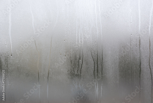 Window with condensate or steam after heavy rain, large texture or background