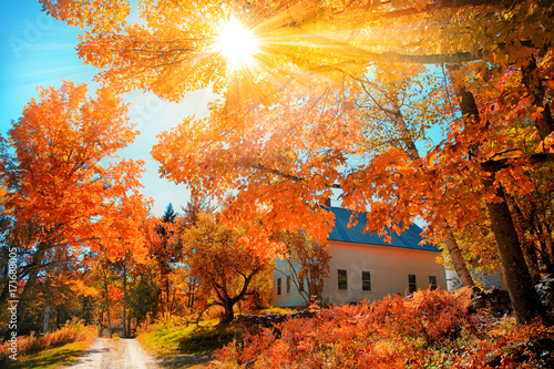 Small church in typical New England town with fall foliage