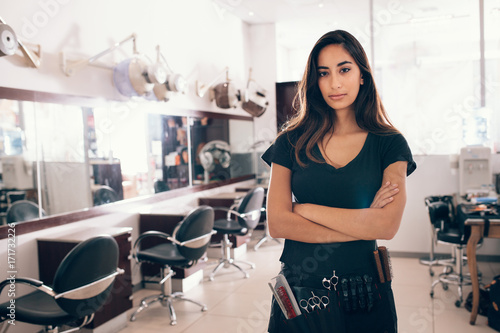Portrait of female hairstylist looking at camera