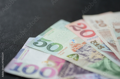 Some banknotes of Georgian lari on a dark background