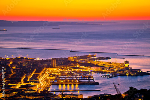 Aerial evening view of Trieste city center and waterfront