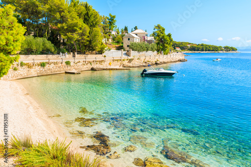 Boat on turquoise sea water of beach in Sumartin town on Brac island, Croatia