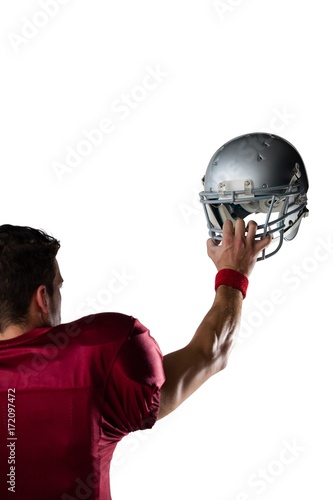Cropped image of player holding helmet