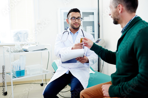 Professional practitioner offering patient effective medication against his disease