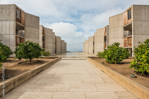 Symmetrical architecture of the Salk Institute in San Diego with orange citrus trees