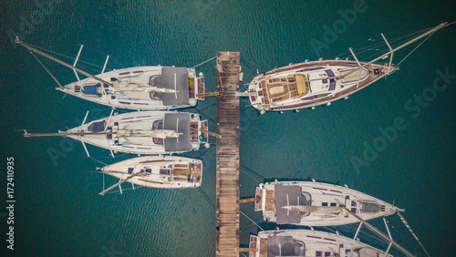 Group of sailing boats anchoring in marina