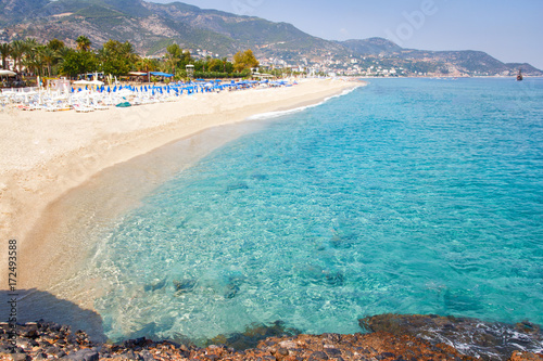 Tropical resort sea beach on summer vacation. Beach with white sand, Alanya Turkey.