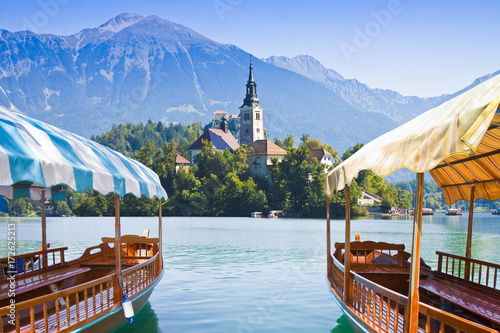 Typical wooden boats, in slovenian call "Pletna", in the Lake Bled, the most famous lake in Slovenia with the island of the church (Europe - Slovenia)