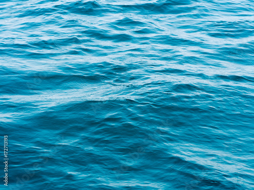 Texture blue ripples water in sea ocean for background. Surface of blue water in nature ocean.