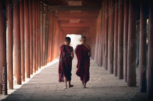 Novices walking at old temple, Salay Bagan Myanmar