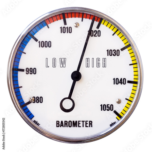 Round analog barometer with scale and words low high, isolated on white background, with clipping path. Barometer with circle shape and analog millibar scale