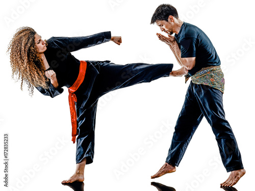 one caucasian woman practicing martial arts Kung Fu Pencak Silat in studio isolated on white background