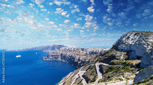 Panoramic view of steep island road with ocean and mountains