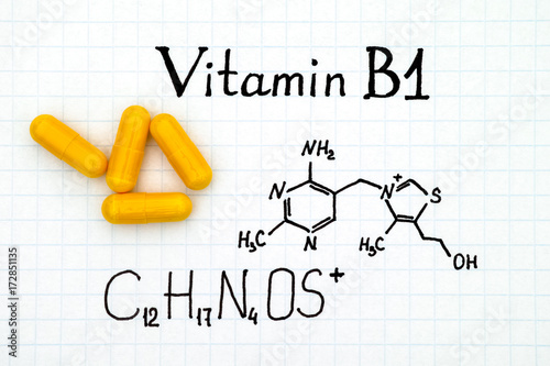 Chemical formula of Vitamin B1 and yellow pills.