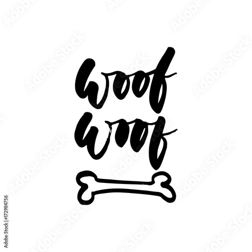 Woof-woof - Symbol of the year 2018 Dog hand drawn lettering quote isolated on the white background. Fun brush ink inscription for greeting card or t-shirt print.