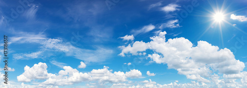 blue sky with clouds and sun reflection.The sun shines bright in the daytime in summer