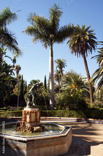 Fountain sourounded by palms inParque de la Alameda (Malaga, Spain)