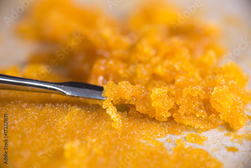 Cannabis concentrate live resin (extracted from medical marijuana) with a dabbing tool