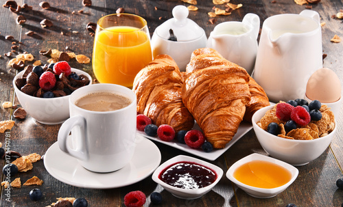 Breakfast served with coffee, juice, croissants and fruits