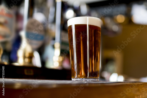 Pint of real ale on a bar in an English pub