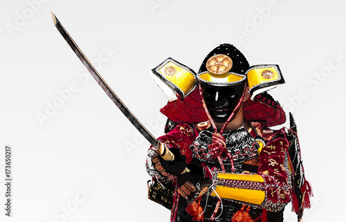 Samurai warrior with sword, isolated on the black background.