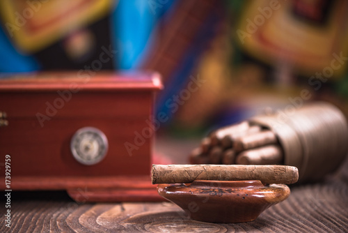 Wooden humidor, cigars and ashtray