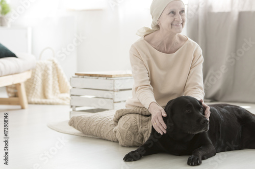 Smiling woman during dog therapy